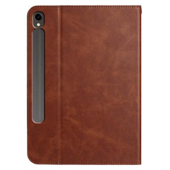 Brown leather tablet case with a strap on a white background