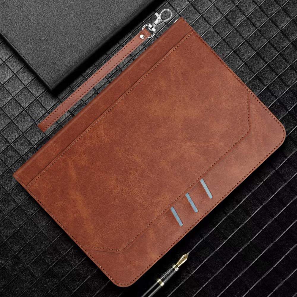 Brown leather pouch with zipper on a textured black surface